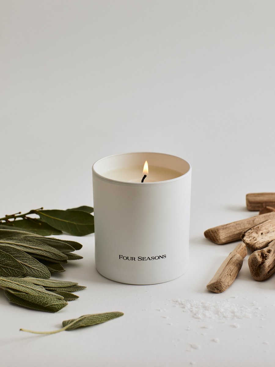 Four Seasons Signature Votive, Island Splendour scent, white candle, fresh marine and driftwood notes, luxury home accessory